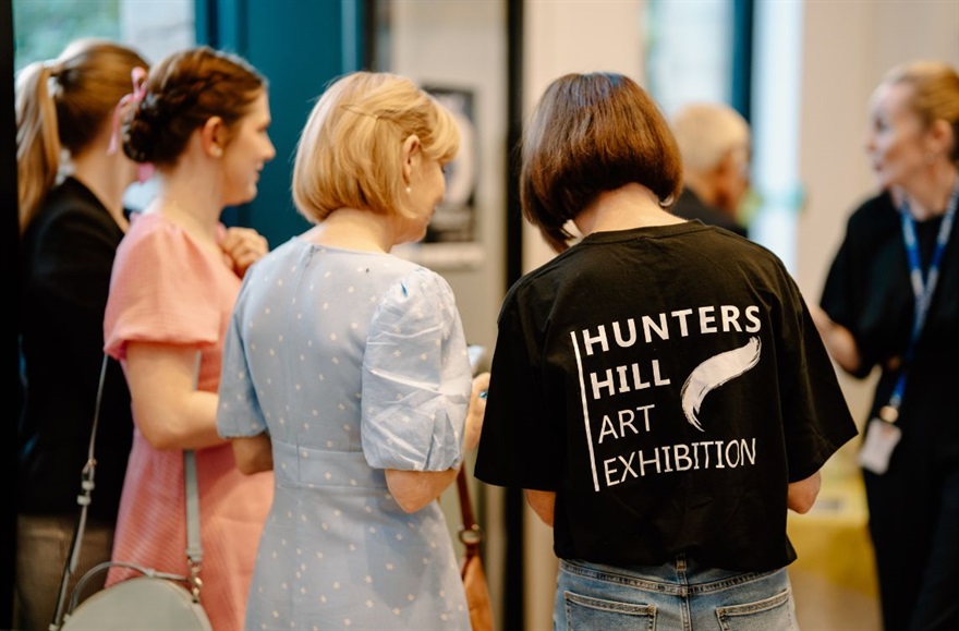 Staff helping attendees at the Hunters Hill Art Exhibition.jpg