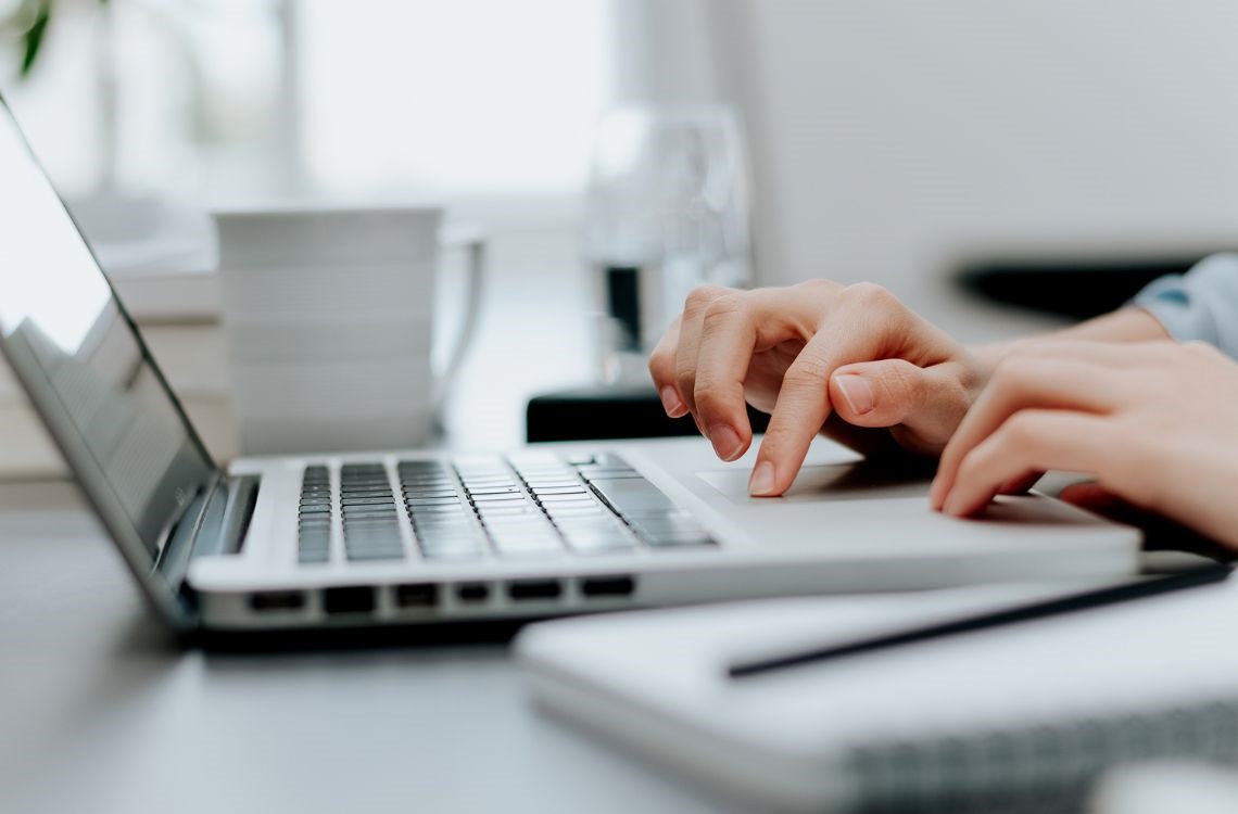 Image of computer and notebook