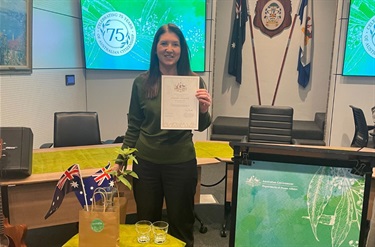 Conferee with her certificate at the citizenship ceremony