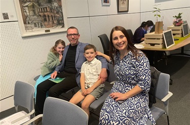 Conferee with his family during the ceremony