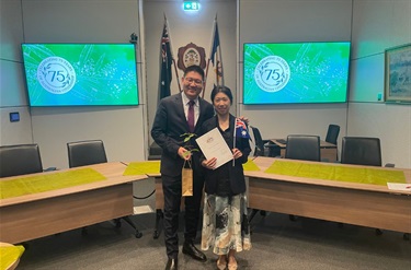 New citizen holding her certificate