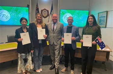 New citizens pictured with Mitchell Murphy after the Citizenship Ceremony